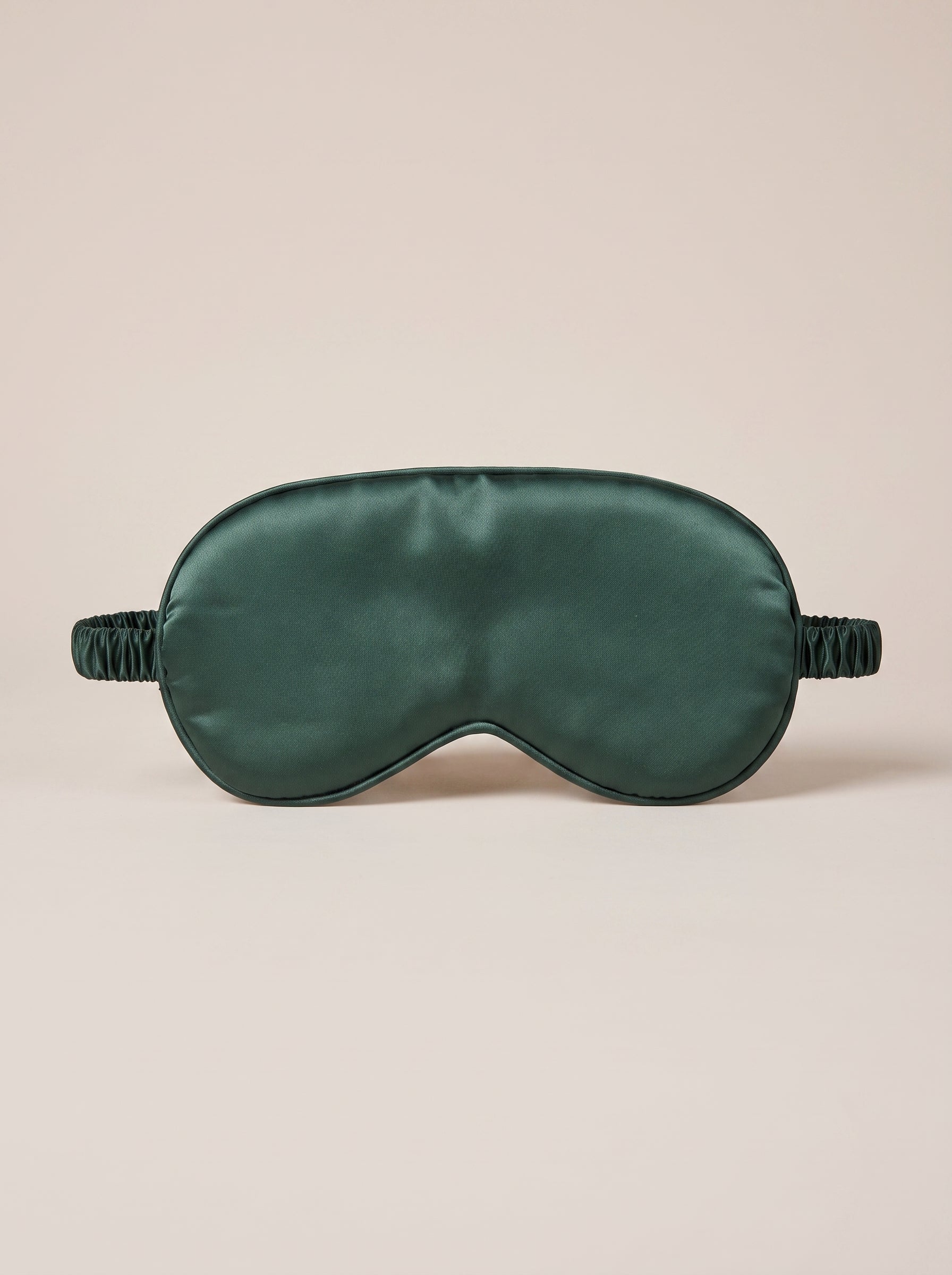 Nuit Sleep Mask in forest green, satin sleep mask with a contoured nose panel and adjustable strap