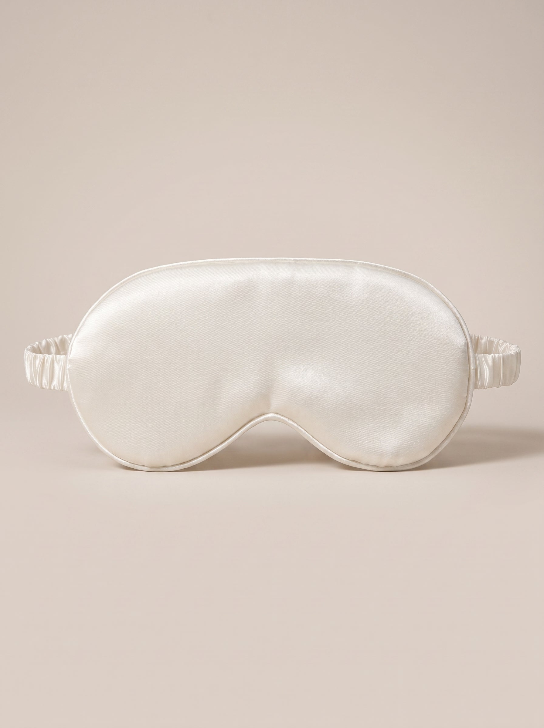 Nuit Sleep Mask in white, satin sleep mask with a contoured nose panel and adjustable strap